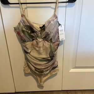 Never worn with tags express size small flattering body contour bodysuit